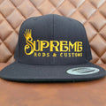 Black flat bill snap back with Hoodrich gold lettering